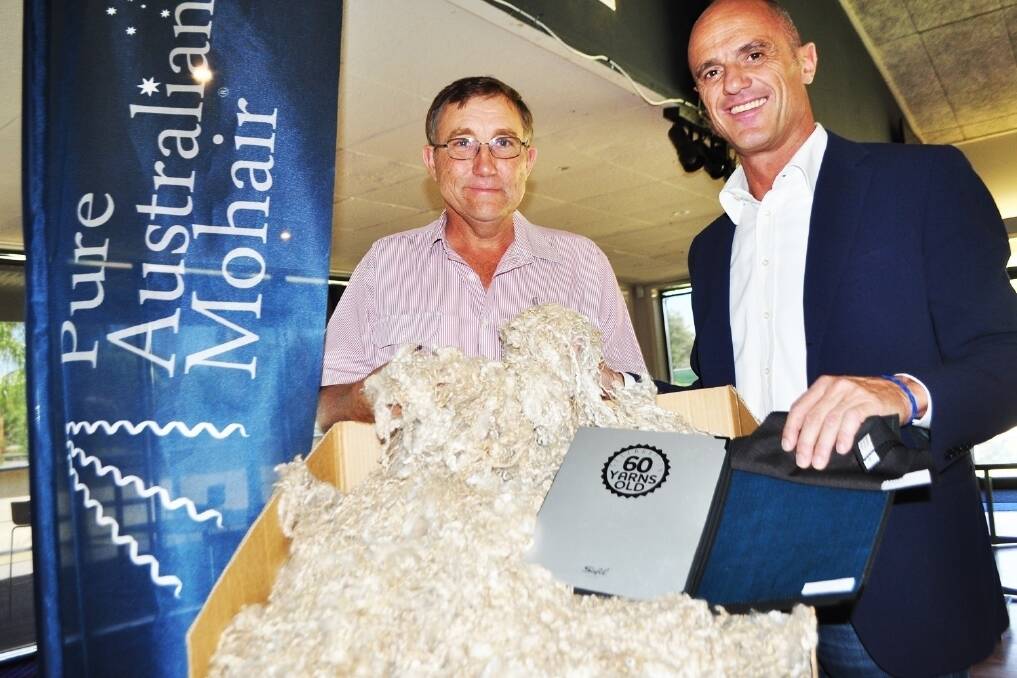 Australian Mohair Marketing Organisation chairman Brett Grant, Tarcutta, NSW, with Italian spinner Cesare Savio, Safil. 