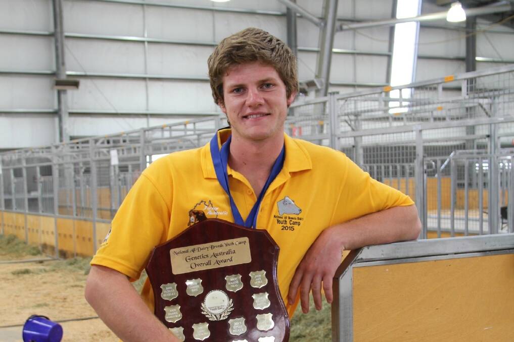 New Zealander Luke Gilbert holding his overall trophy.