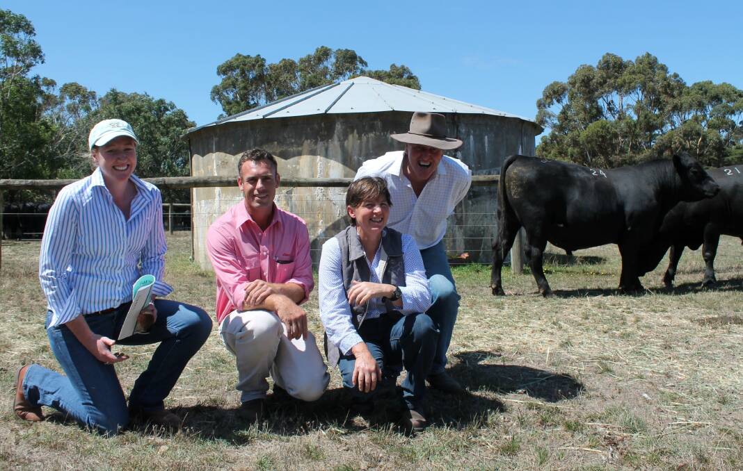 Susan Russell and David Shaw of Dunneworthy, near Ararat, with Elders, Mortlake livestock agent Hayden Lanyon and Barwidgee principal Wendy Kelly. Ms Russell and Mr Shaw paid the sale's top price of $6250 for Lot 24, Barwidgee 13224 (pictured).