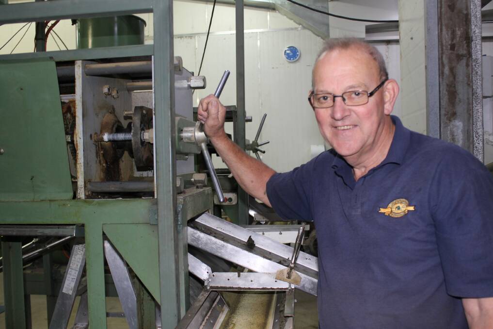 Fred Davies with one of the oil presses used at Stoney Creek Oil Products.