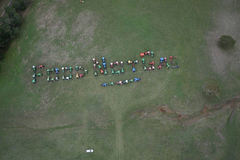 An aerial view of more than 65 tractors assembled on a North Byaduk farm yesterday to spell out FOOD NOT GAS as local farmers ramped up their opposition to gas mining.  Picture: JILL FRAWLEY.