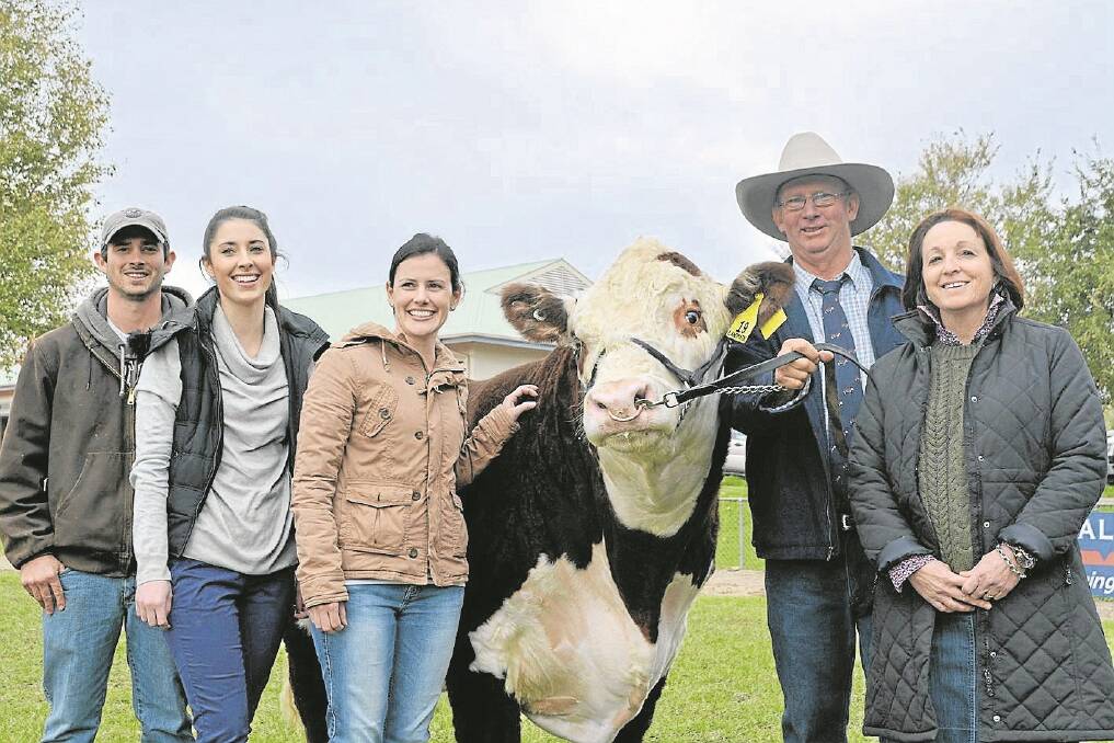 Tom (Cootamundra, NSW), Gillian (Wagga Wagga, NSW), Justine (Cootamundra) Andrew, and Leanne (Euroa, Victoria) Green, Yarrandabbie Herefords, with their $40,000 top-priced bull Yarrandabbie Jingle J018.
