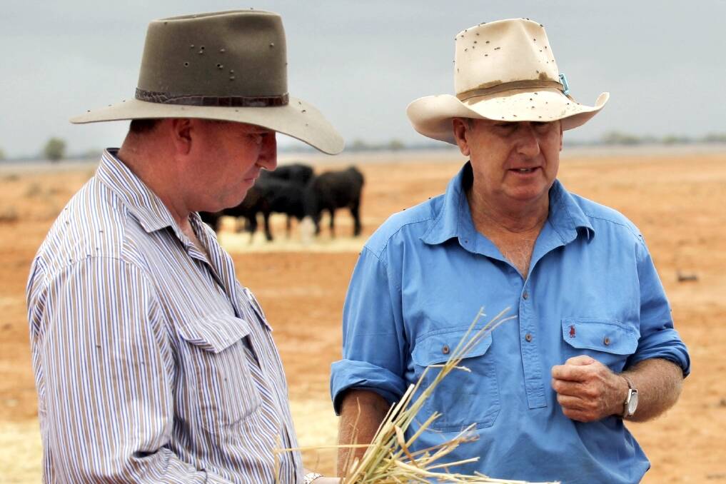 Agriculture Minister Barnaby Joyce met grazier Phillip Ridge of "Jandra" near Bourke, NSW, as part of a drought tour with Prime Minister Tony Abbott in February 2014. Photo: Andrew Meares