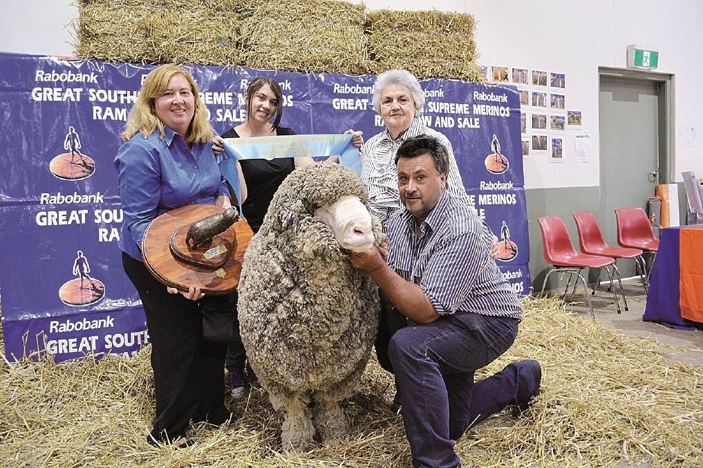 The Chapman family – Laura, Kelly, Marie and Drew Chapman, West Plains Merinos, Delegate, NSW, with the supreme exhibit of the 2015 Great Southern Supreme Merino Show and the Sydney Royal, West Plains Mercenary, a medium March-shorn Poll Merino ram.