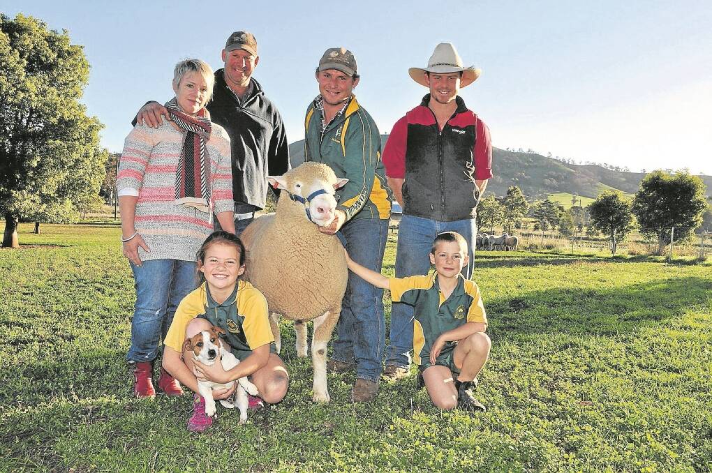 The Scott family from Valley Vista and Valley Vista Park Poll Dorset stud at Coolac with a Valley Vista ram, which weighs 148kg at 14 months-old and will be shown at the Australian Sheep & Wool Show. Pictured are Donna and Andrew Scott and their children Joe (holding the ram), James, Sally, 10, (holding Teepee), and Zac, 6.