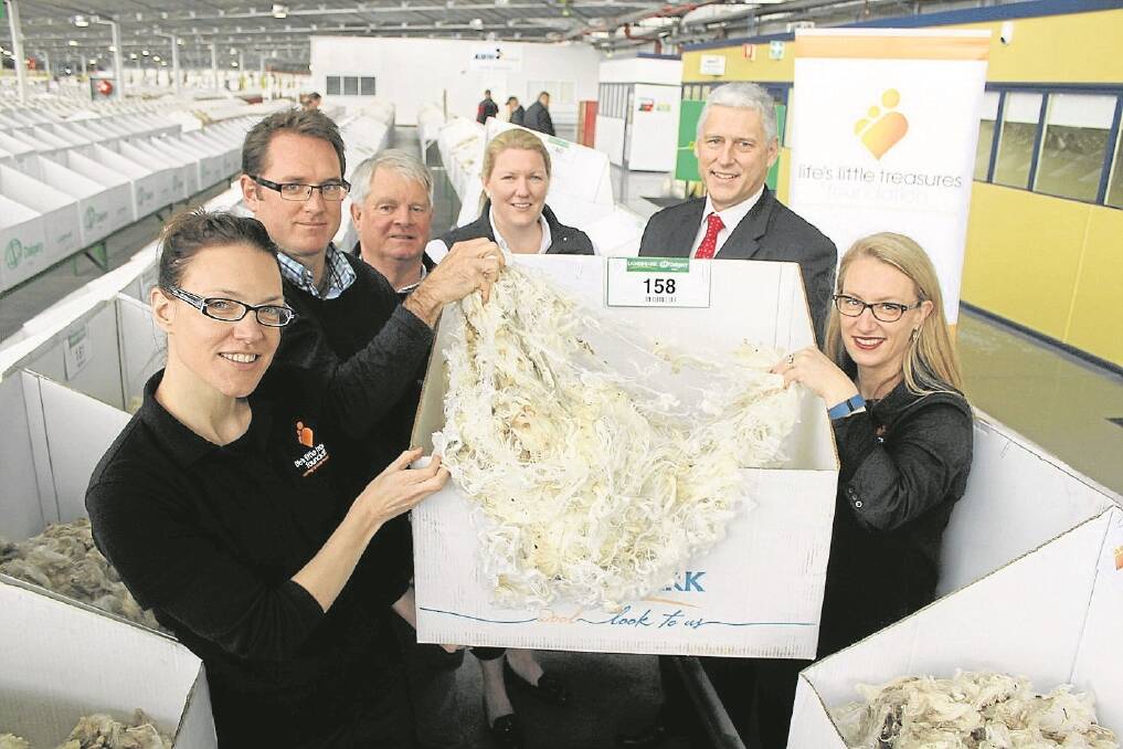 Little Treasures Foundation’s Beth Allan, United Wool Company’s Andrew Jackson, Australian Sheep & Wool Show’s Graeme Harvey, Landmark’s Candice Cordy, AWTA’s Tim Steere and Life’s Little Treasures’ Kelli Hugo check out some of the donated wool that went under the hammer last Wednesday.