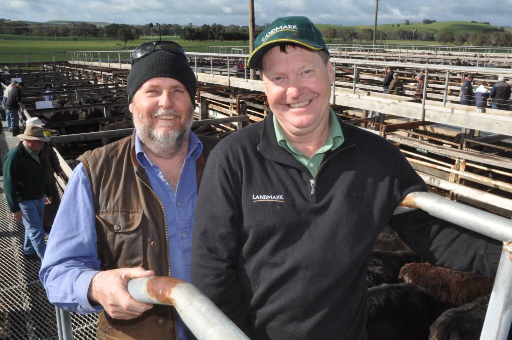 Geoff Sinclair,Noss, Casterton pictured with Landmark Casterton's Andrew Harrison dispersed his Angus herd after selling the property. The cows with calves topped at $2300 and PTIC heifers topped at $1560.