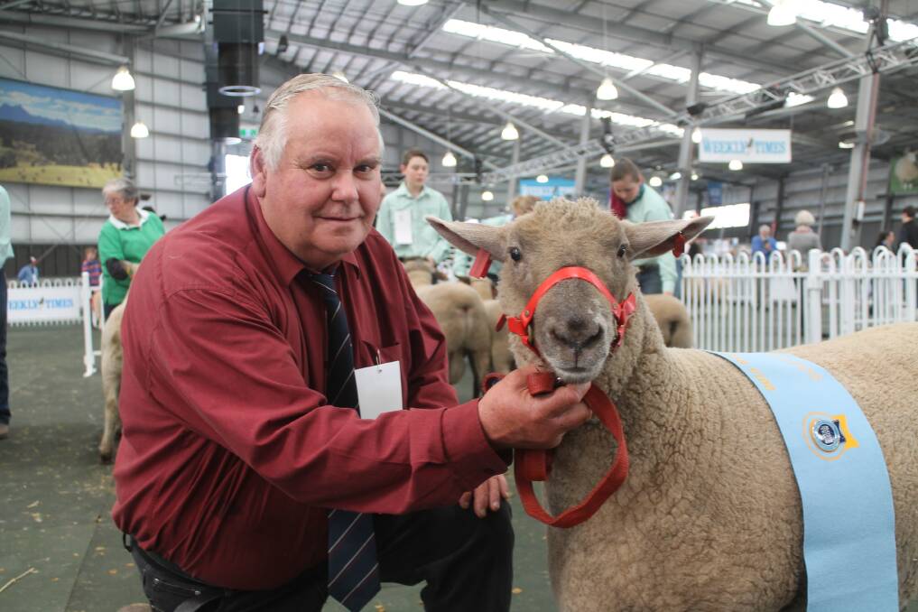 Barry Shalders, Willow Drive, Derrinallum, with his supreme champion South Suffolk at the Royal Melbourne Show, a 12 month-old ewe.