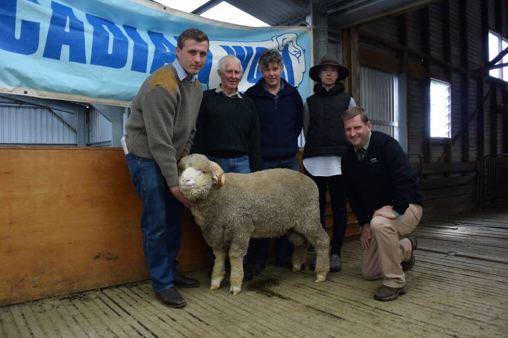 Sam Crawford (left), Rock-Bank Merino Stud, Victoria Valley, Victoria holds the top-priced ram and is pictured with buyers Noel and Russell Hartwich, Kelseldale Merino Stud, Ballyrogan, Victoria, Nicole Crawford, and (back from left) Landmark southern NSW stud stock representative Rick Power.