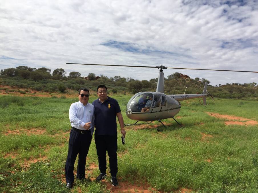 President of Sino-Australia Top Beef Beijing Mr Zhang Yong and Vice President Australian Prime Meat Co and SATB Beijing Mr Zhou Ligong prepare for a helicopter view of northern Australian beef country.