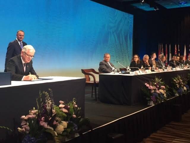 Trade and Investment Minister Andrew Robb signing the TPP in NZ that must now be ratified.