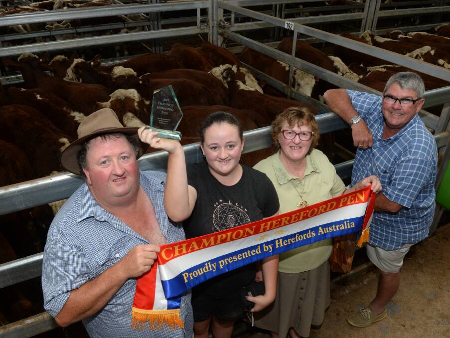 David McCormack, Tallangatta, won Champion Hereford for his steers at Wodonga, Friday. With David was Claire (trophy), grandmother Jeanette, and buyer Barry Thiel.