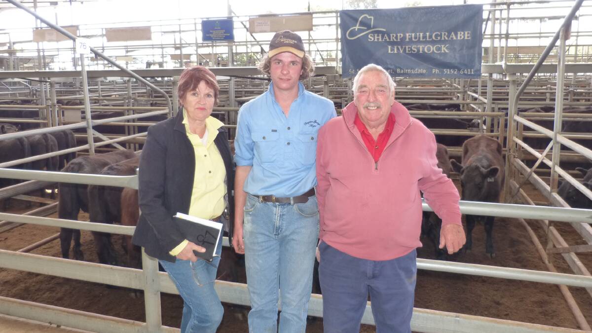Lea and Barry Worseldine, Creightons Creek Angus, with their grandson, Connor McMCormack who is doing work experience with Sharp Fullgrabe at Bairnsdale. Lea and Barry sold these yearling Angus heifers for $1100.