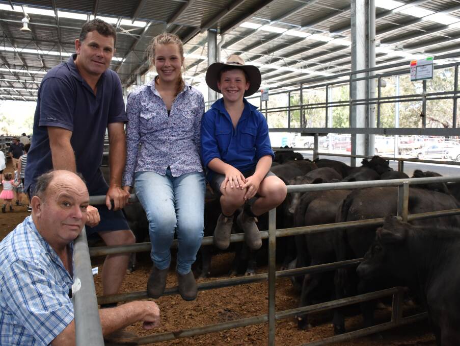 Gilbert, Andrew, Hannah and Lachlan Armstrong reflect on the sale of the their 118 Angus steers sold at Yea, Wednesday. Their steers sold to $1410, av $1350.