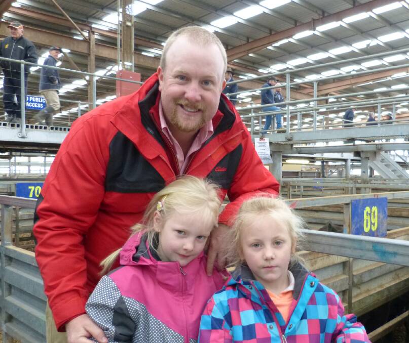 School holidays saw lots of children come to the Pakenham sale, last Thursday. Elders Korumburra agent Alex Dixon was looking after daughters Keira and Zahli.
