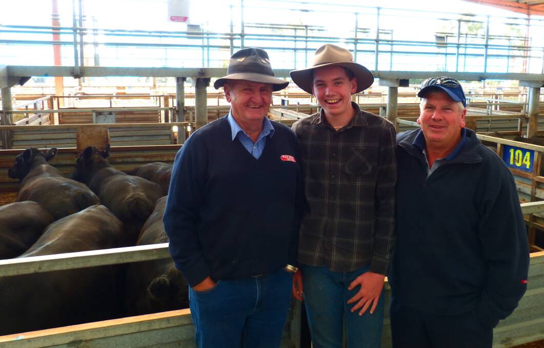 Alex Scott & Staff agent, Roger Tweddle, grandson, Cameron, and Ross Gaul, manager, Marble Hill, Brandy Creek, at Pakenham. There Angus steers, 601kgs, sold for 300c/kg.