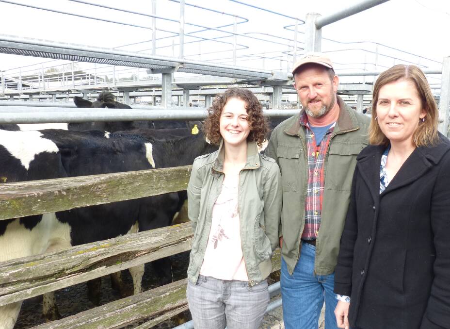 SOLD: Laura (left), Graeme and Jacque Reynolds after the dispersal of their dairy herd at Warragul, last Friday. Their 88 cows sold to a top of $1600 to average $1018.