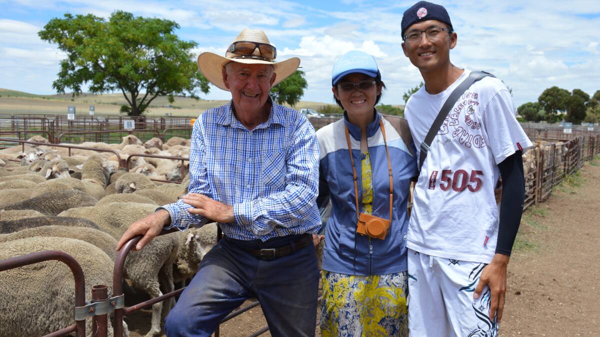 TOURISTS: Glenn Hammat, Washpool, at a recent Jamestown sheep sale with tourists Chia-Ni Lin and Chia-Nan Chien, who were visiting from Taiwan.