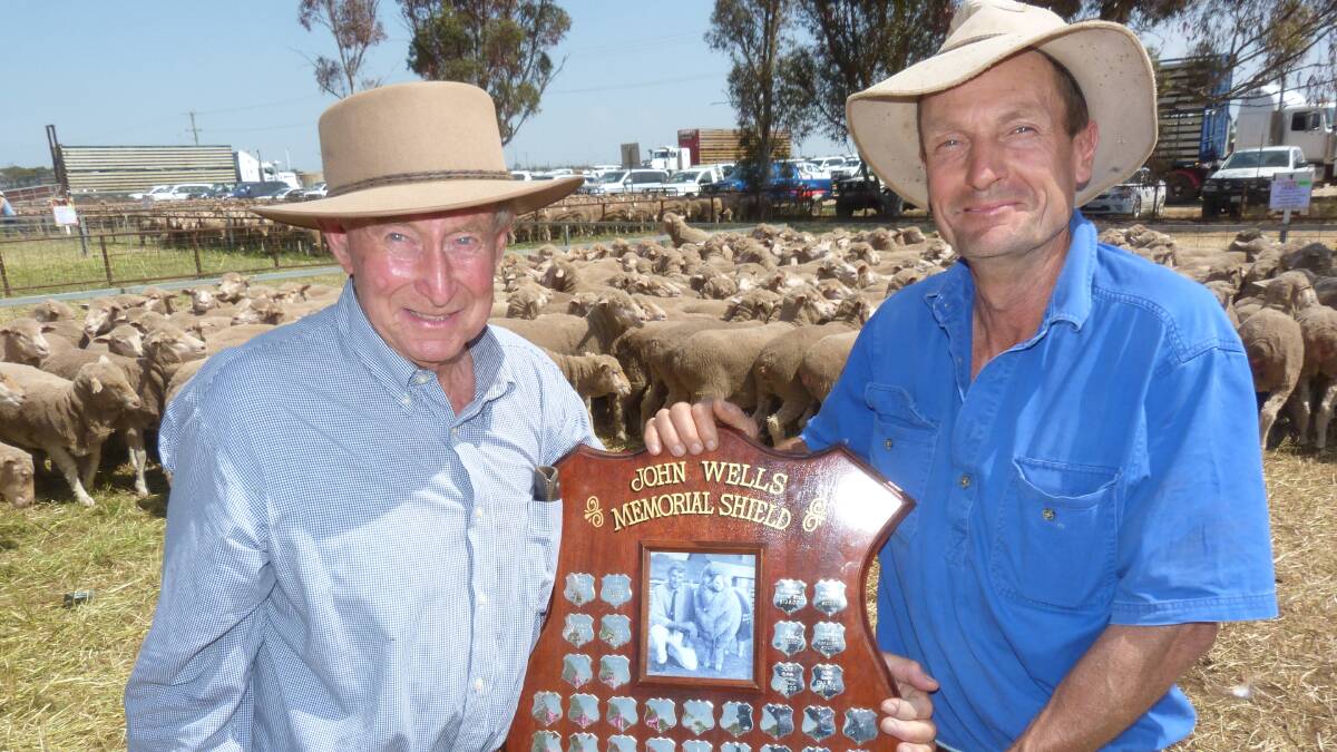 Andrew Sleigh, Sleigh Pastoral accepted Ross Wells, Willandra the John Wells Memorial shield for the highest priced one year-old ewes sold at Jerilerie