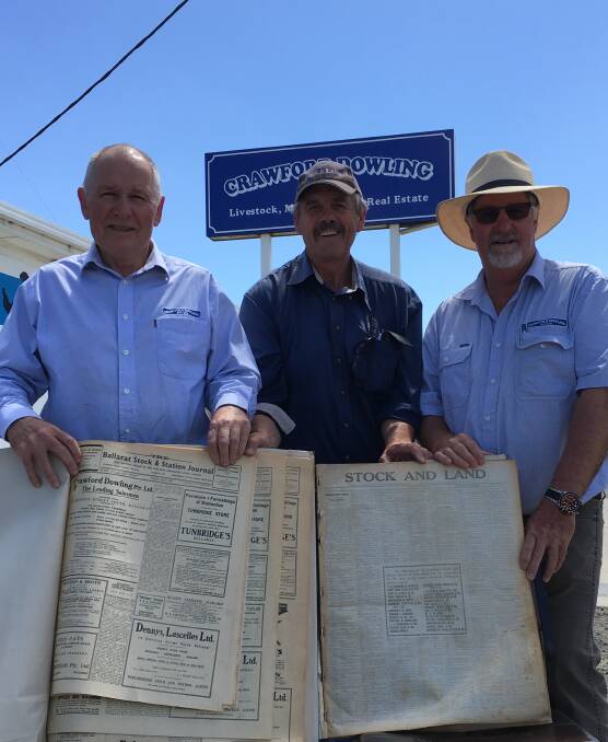 Crawford Dowling directors, Tom and Barclay Dowling, and Murray Arnel, Stock&Land with bound copies of turn-of-the-century stock reports found in the CD storeroom