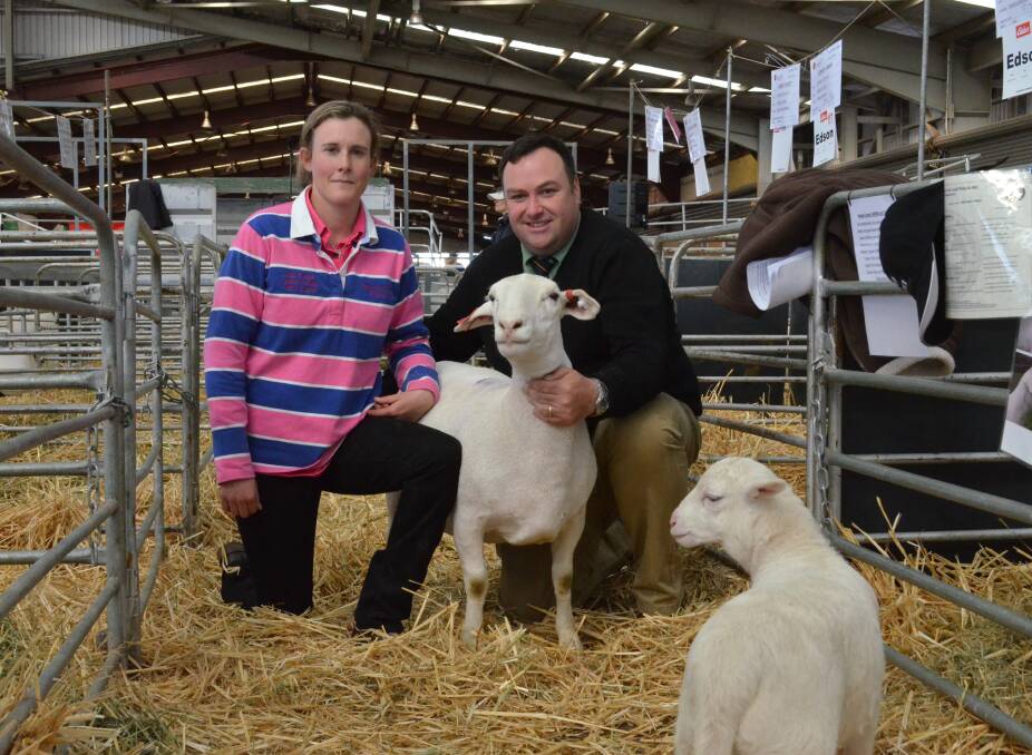 TOP PRICE: Andrea van Niekerk, of Moama, (pictured with Brad Wilson Landmark Dubbo) sold the 2015 top White Dorper ewe for $2800.
