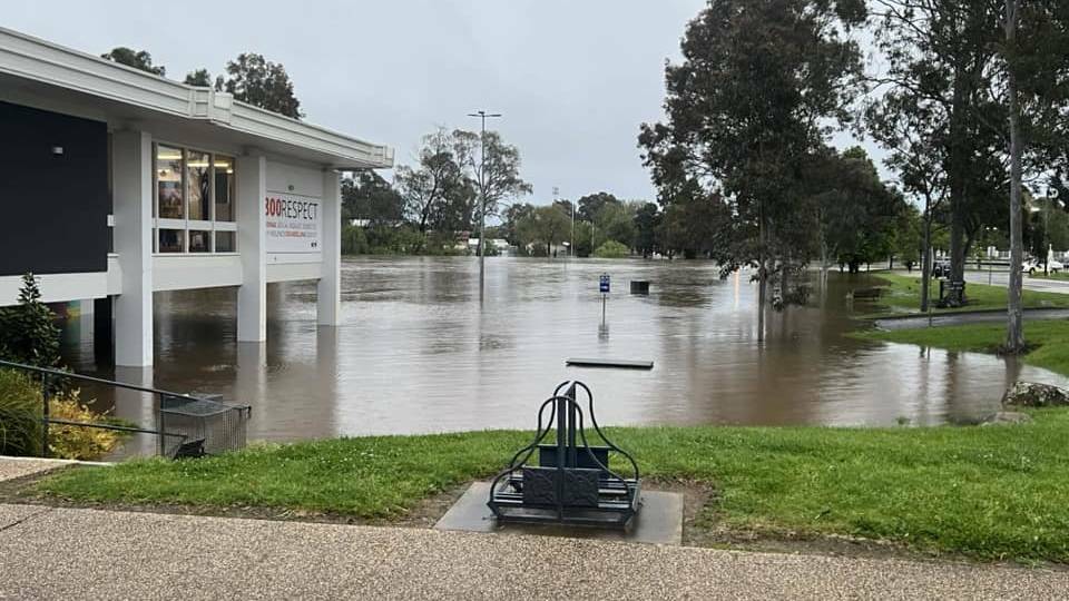 Floodwaters surrounding the Benalla Library. Later that day the water rose right up to the window in this photo. Picture by Mattie Hooker