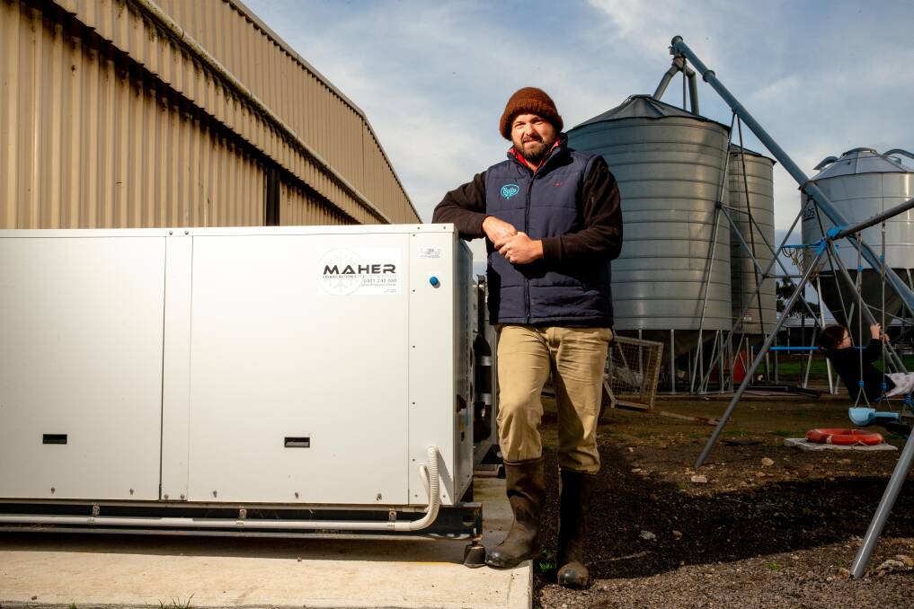 NEW TECH: Peter Doolan stands next to his sustainable cooling system. Photo by Chris Doheny.