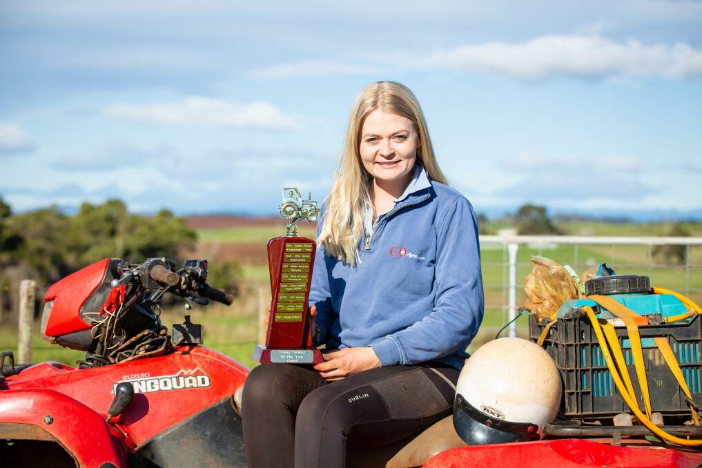 Success: Moriarty farmer Caitlin Radford with the trophy she won after being named Tasmanian Young Farmer of the Year. Picture: Eve Woodhouse.