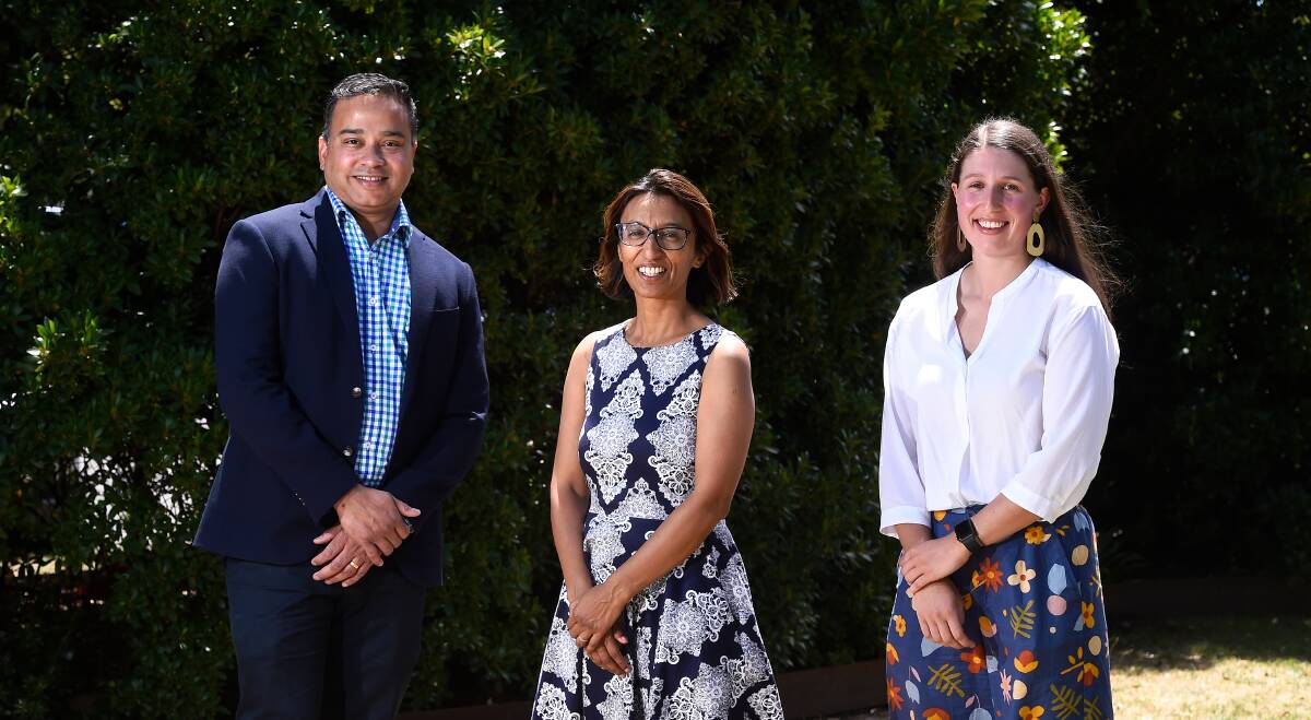 (L-R) Melbourne University's Dr Abhishek Mitra and Dr Shabna Rajapaksa with student Lily Corboy. Photo: Adam Trafford