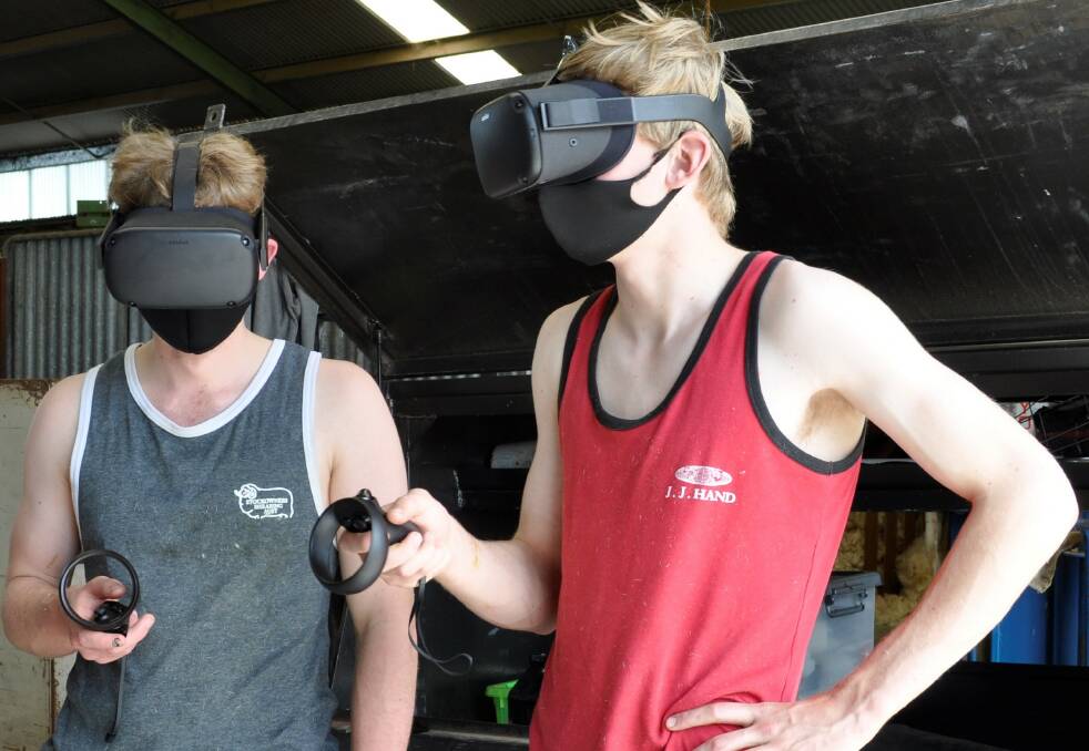 Hamilton RIST students Hamish Cameron and Tom Burland learn to shear sheep using virtual reality. Picture supplied by RIST