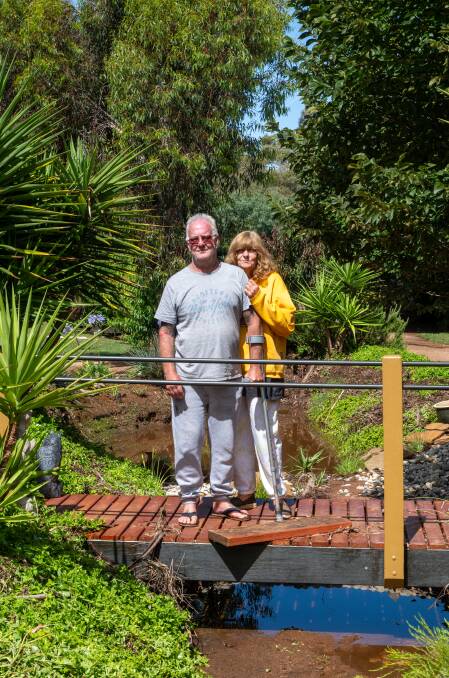 Jennie Schultze, with partner Haiden Mellford, lost her engagement ring in floodwaters that coursed through the couple's Wedderburn property on Christmas Day. Picture by Enzo Tomasiello