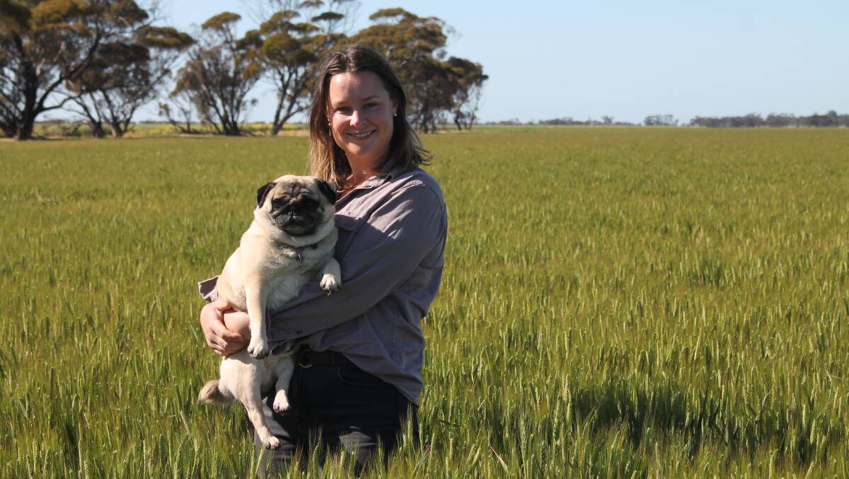 Georgina Warne, Culgoa, said yields were looking better than expected from this year's harvest. With pup Walter. Picture by Philippe Perez