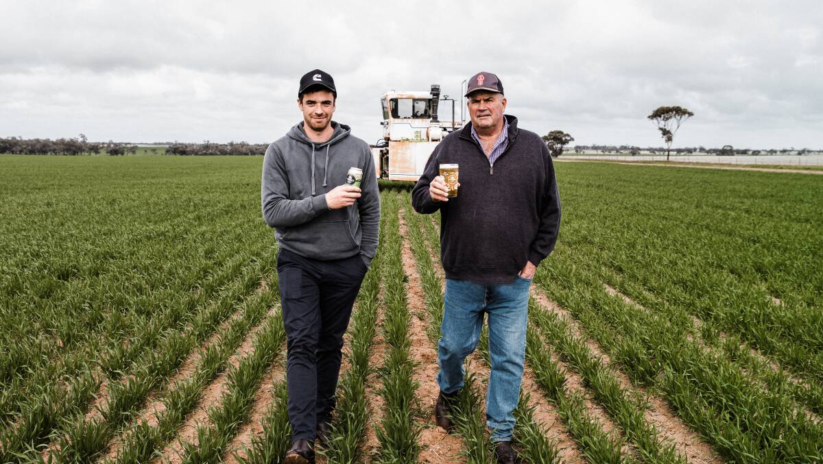 MALT WHEAT: Farm worker Alex Cameron and Paul Barclay (left). Mr Barclay's farm in Curyo supplied wheat to one of Australia's newest wheat ales - 4 Pines Aussie Wheat Ale. 