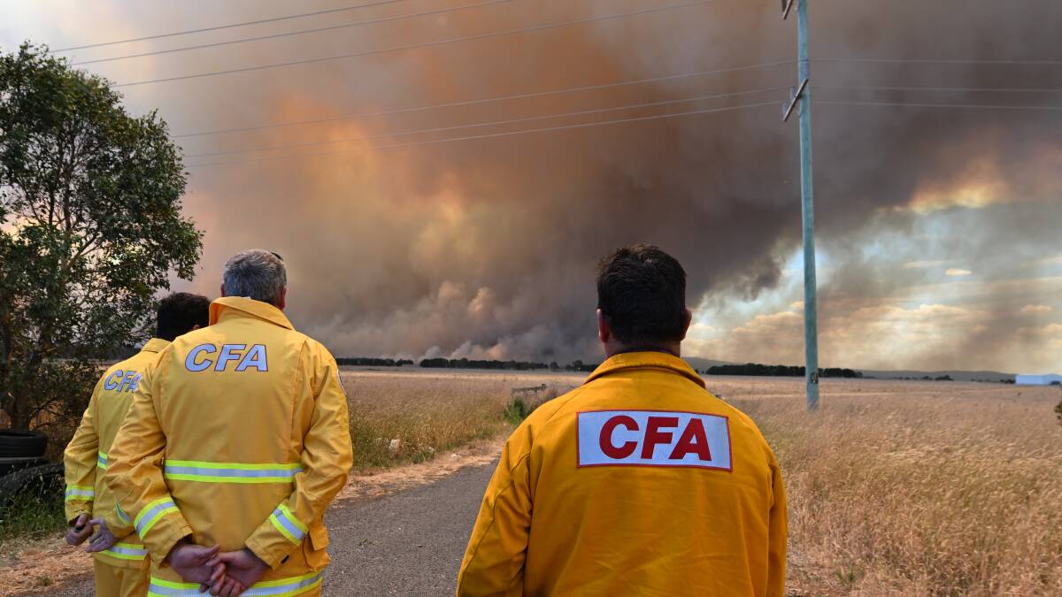 Firefighters watching a growing blaze near Beaufort. Picture by Lachlan Bruce.