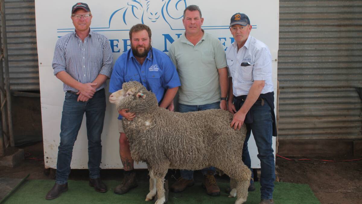 Stud classer Dale Bruns, Hamilton, worker Tristan McMahon, Peter Waters, Rockview, Nareen and Nareeb Nareeb stud principal Richard Beggs with the top priced ram Lot 62 221564. Picture by Philippe Perez