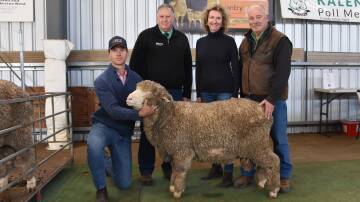 PROUD SALE: Co-stud principals Jack, Lynne and Jack Beaton, Kevlyn, Coojar with Nutrien stud stock Merino specialist Stephen Chalmers and their ram KLN 210011 which sold for $20,000 in a private on-farm sale.