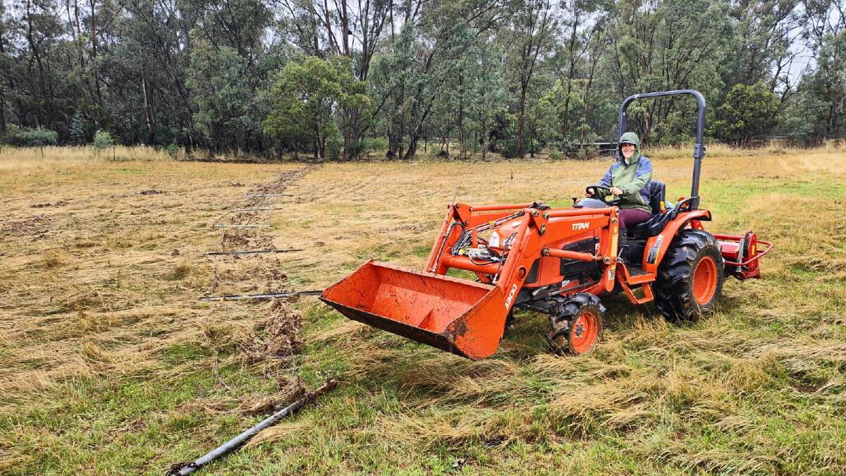 Courtney Hazeldene, Ganado Greys, Marong, beginning to clean up her fencing after a deluge of 94mm on her property on Sunday evening. Picture supplied.