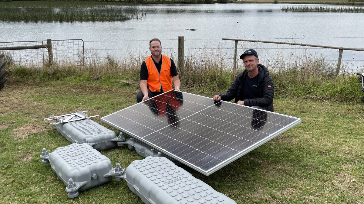 Greenwood Solutions managing director Tom Johnson with environment manager and training facilitator Veli Markovic with a floating solar panel in front of Lardner Park's lake, which will be the site of a major trial for potential use on farm land. Picture by Philippe Perez