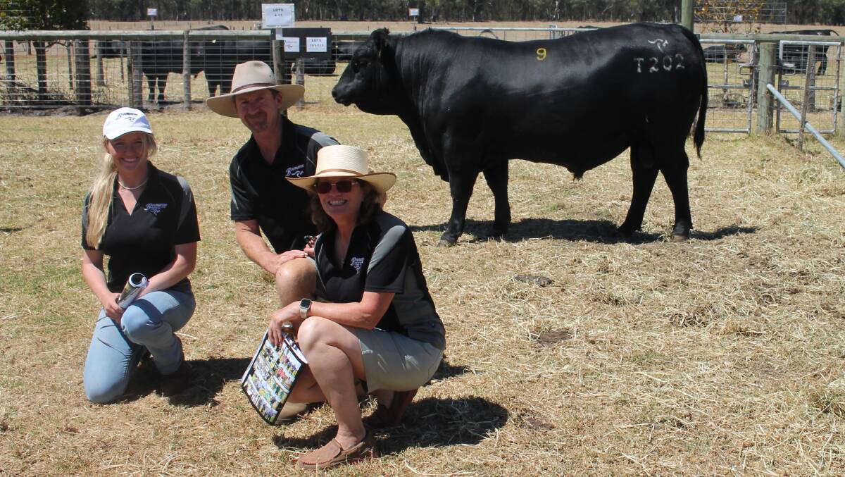 Claire, Shane and Jodie Foster, Boonaroo, Corndale with the top priced bull of the day, Lot 9, Boonaroo Effective T202, which sold for $34,000 to Princess Royal Station, Burra, SA. Picture by Philippe Perez