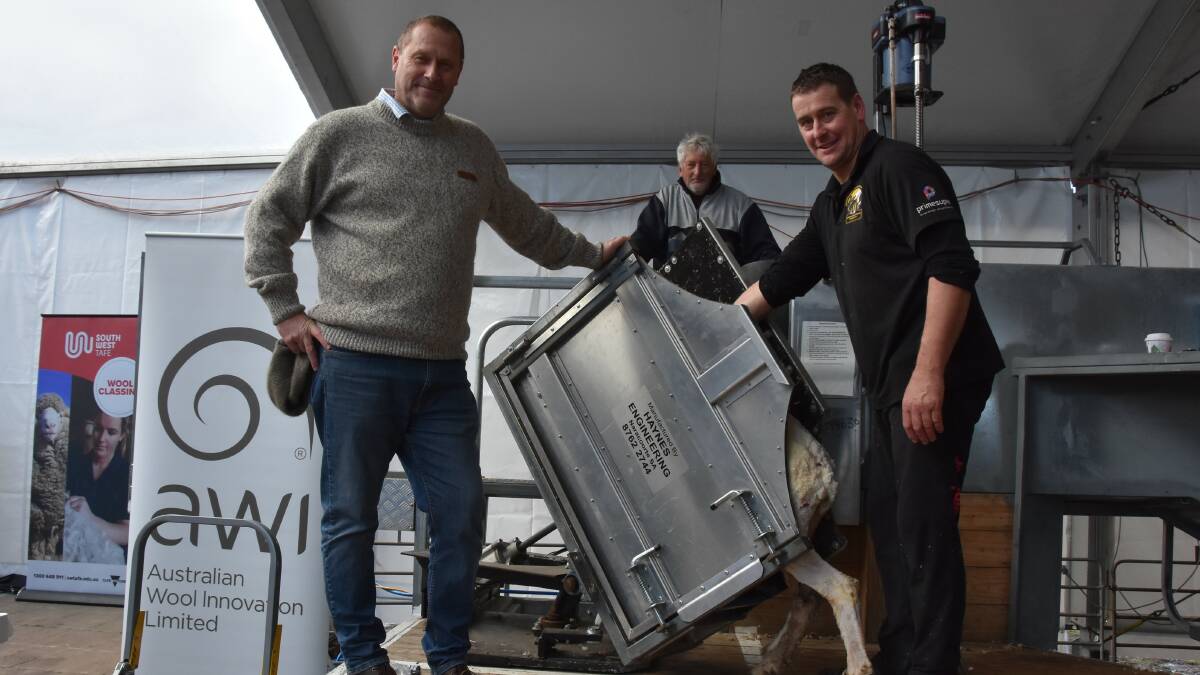 NO MORE DRAG: Glen Haynes, Terry Rowbottom and Nathan Fidler, Hayes Engineering, Naracoorte, SA, with their prototype catch-and-deliver shearing race displayed at Sheepvention.