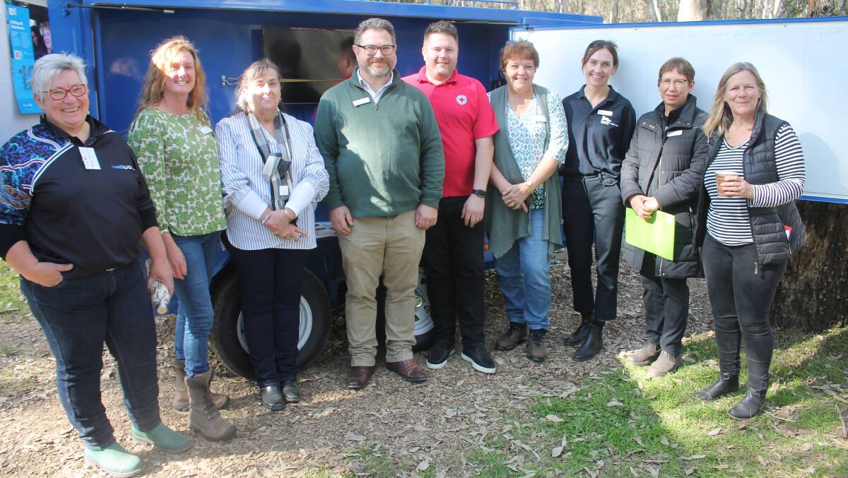From left, New Access Wellways mental health coach Nicole Stephens, Alpine shire emergency management coordinator, Karen van Huizen, independent emergency management consultant Trudi Pratt, Hume Riverina Community Legal Service lawyer David Whitehorse, Australian Red Cross disaster recovery officer Jai Edwards, community recovery officer Helen Hunter, Emergency Recovery Victoria representative Jamie Meyer, Hume Riverina Community Legal Service bushfire lawyer Sara Reid and Alpine shire community recovery officer Melanie Chester. Picture by Philippe Perez