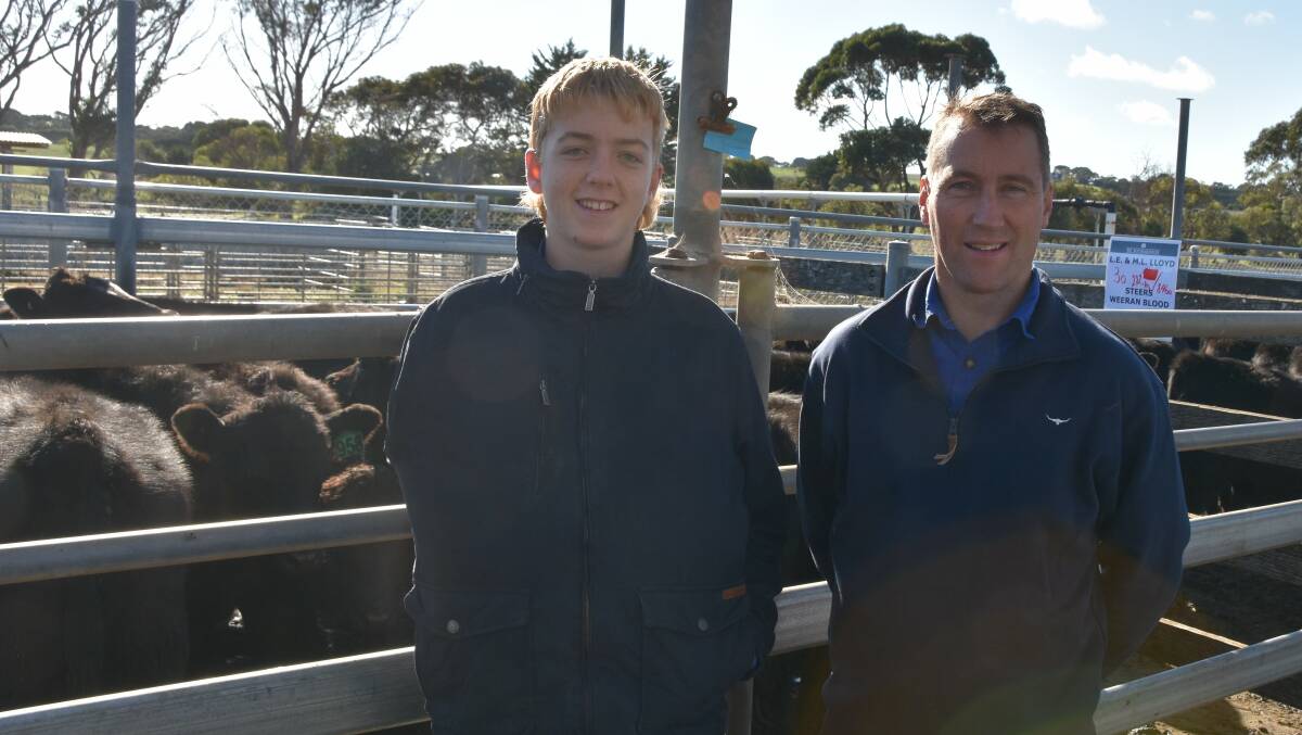 HAPPY VENDORS: Lance Lloyd (right), Warrong, sold a pen of 30 Angus steers with Weenan blood, 282kg for 748 c/kg or $2110 a head with Austin Lloyd.