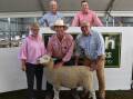 GREAT SALE: Waratah White Suffolk stud principals Debbie and Steve Milne, with the top-priced ewe, Lot 47, 200556, sold to Lachy Day, Days Whiteface, Bordertown, SA, Elders Victoria/Riverina stud stock manager Ross Milne and LMB auctioneer Bernie Grant.