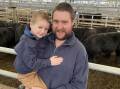 SALE: Harry, 3, and Richard Clark, Mirboo, sold this pen of 9 Angus steers. 