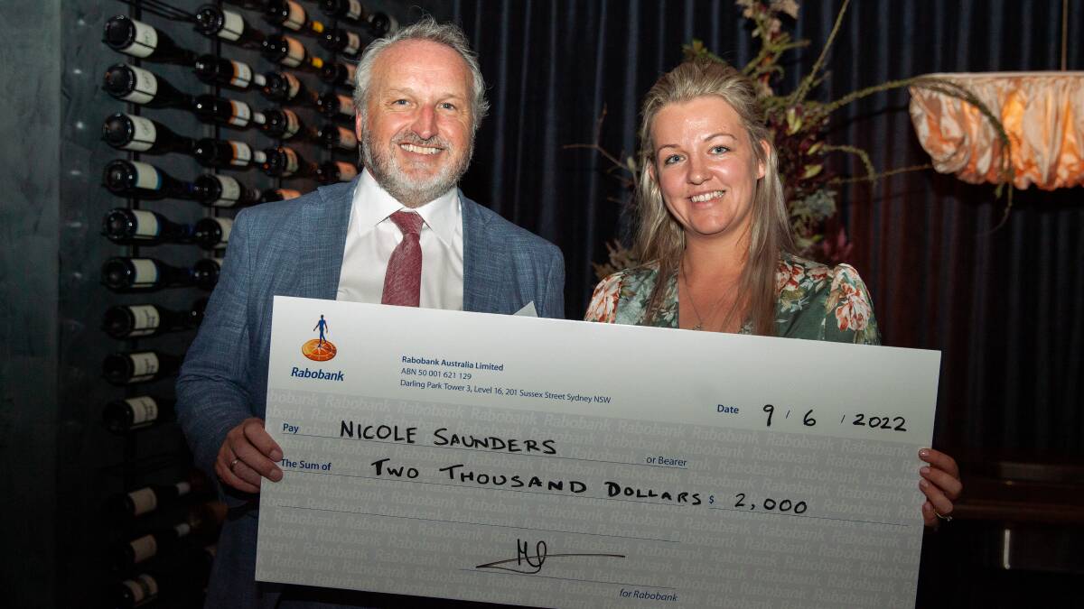 ACHIEVEMENT: Rabobank general manager sustainability and community Marc Oostdijk presents an award to Nicole Saunders at the 2022 Farm Managers Program graduation in Sidney. 
