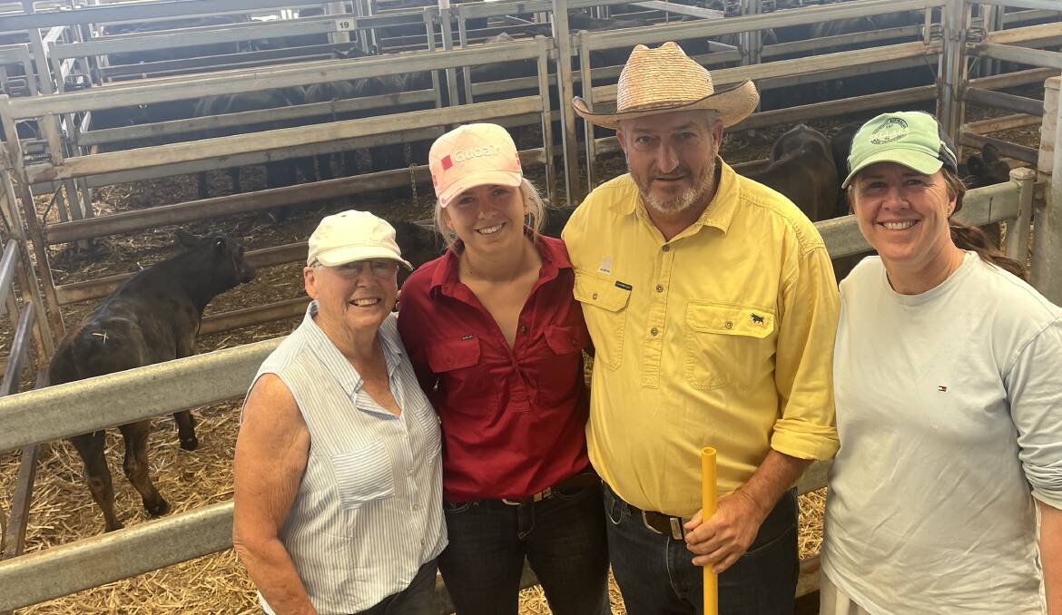 Ray White agent David Benson with three generations of the same family, Lee Lawther, Lily and Jodi Spice, Baranduda, and their pen of six Angus steers that sold for $630 a head at Wodonga on Saturday. Picture by Alexandra Bernard.