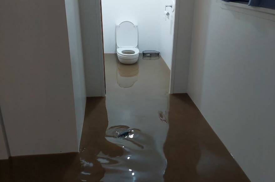 The Elliotts were almost powerless to stop 20cm of water entering their house. Picture supplied.