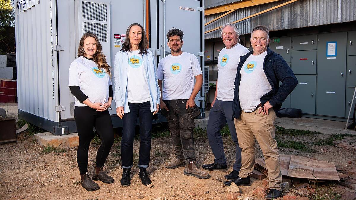 Totally Renewable Yackandandah committee members Clare Bishop, Juliette Milbank, Ben Gilbert, James Jenkins and Matthew Charles-Jones in front of the community battery, at an old sawmill site. Picture supplied