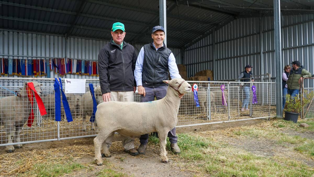 Nutrien stud stock manager Peter Godbolt and Chandpara Southdown stud principal Andrew Sellars-Jones with the top-priced ram, Lot 27. Picture by Rachel Simmonds