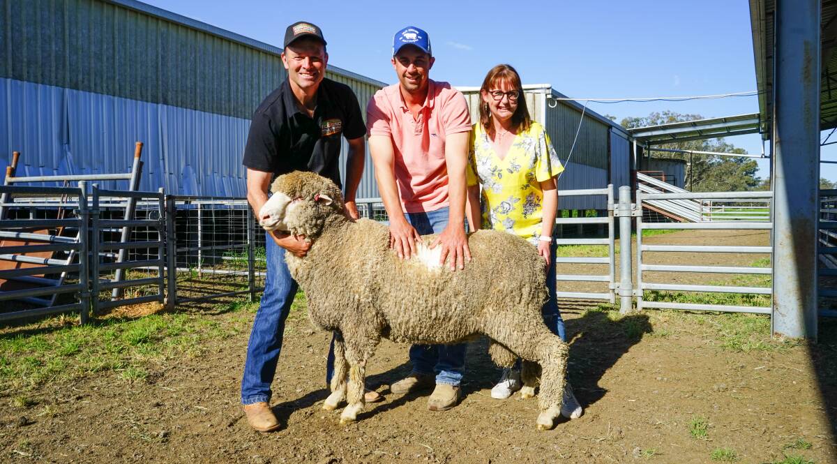 Simon Riddle, Toland Poll Merinos, Ben Clark, Ernest Ag, Wagga, NSW, and Anna Toland, Toland Poll Merinos, Violet Town, with the top-priced ram. Pictures by Rachel Simmonds